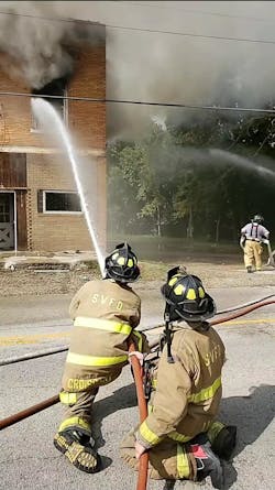 More than 15 fire departments battled an apartment blaze Monday in Depue, IL, that injured a Spring Valley firefighter.
