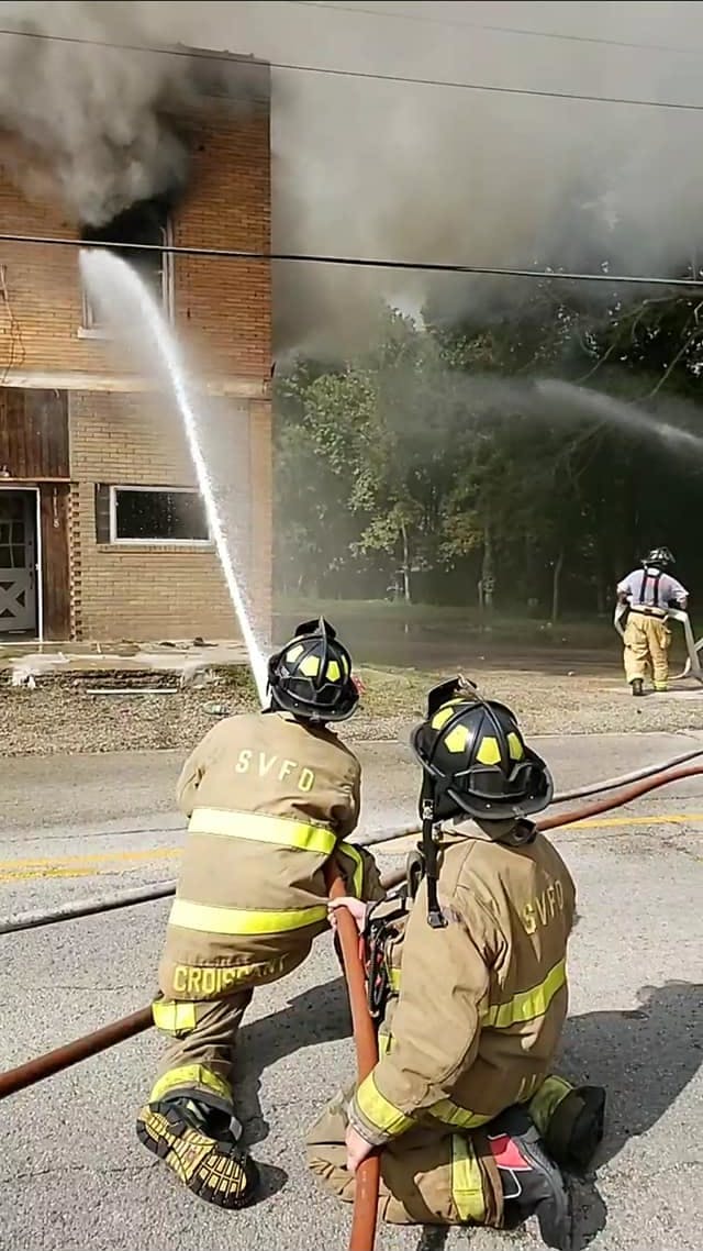 More than 15 fire departments battled an apartment blaze Monday in Depue, IL, that injured a Spring Valley firefighter.