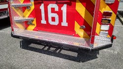 The rear step on this Pierce engine was designed for safety in mind including corner steps, Bustin non-slip inserts and heavy rub rails on each side of the body and rear step. The rear step on this Pierce engine was designed for safety in mind including corner steps, Bustin non-slip inserts and heavy rub rails on each side of the body and rear step.