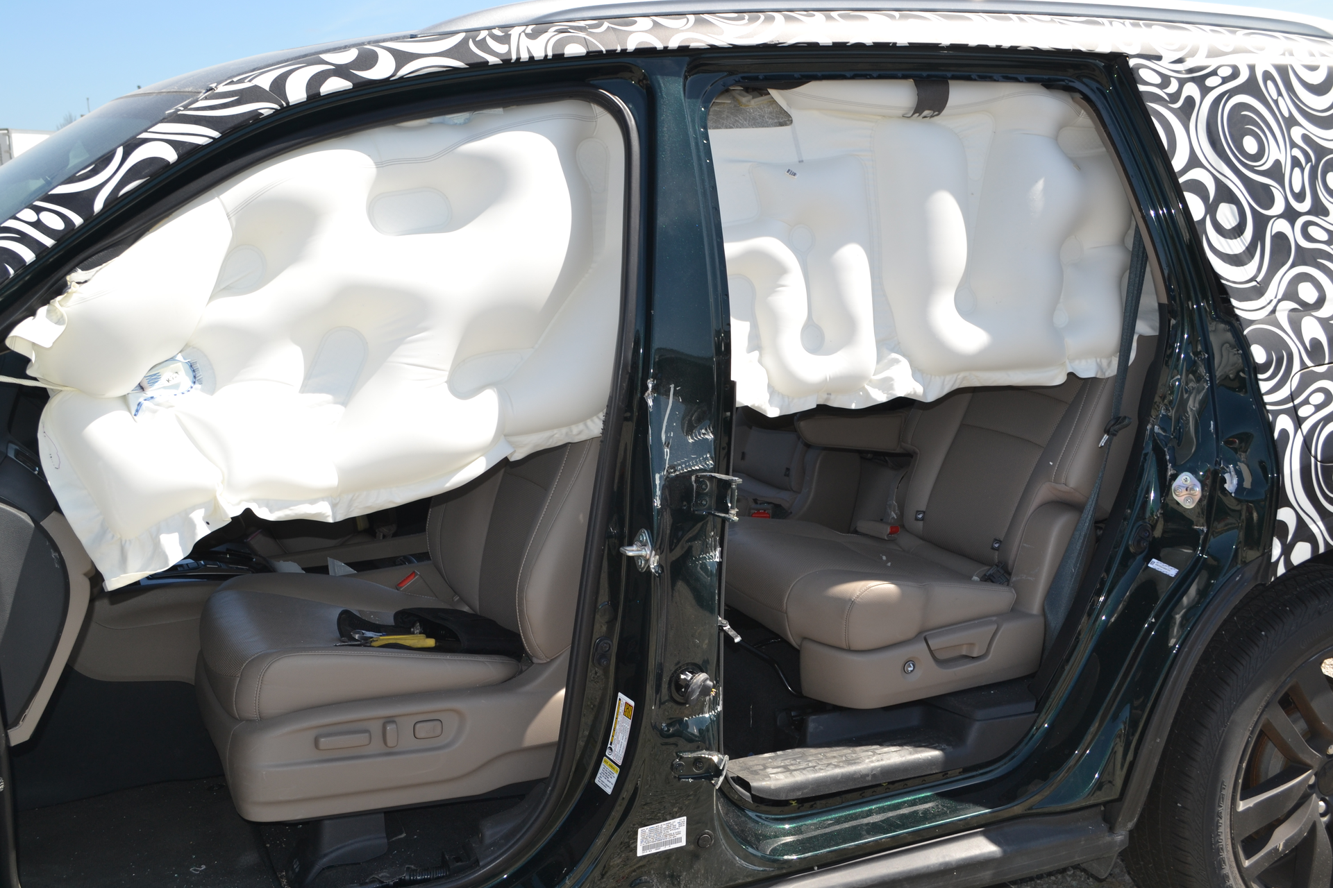 The anti-ejection design of this roof airbag system allows it to deploy and remain firm and seemingly fully inflated long after the initial drop down of the airbag. Note the 'fat' parts and the 'thin' parts of the airbag itself. Photos by Ron Moore