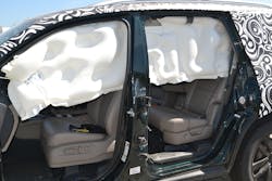 The anti-ejection design of this roof airbag system allows it to deploy and remain firm and seemingly fully inflated long after the initial drop down of the airbag. Note the &apos;fat&apos; parts and the &apos;thin&apos; parts of the airbag itself. Photos by Ron Moore