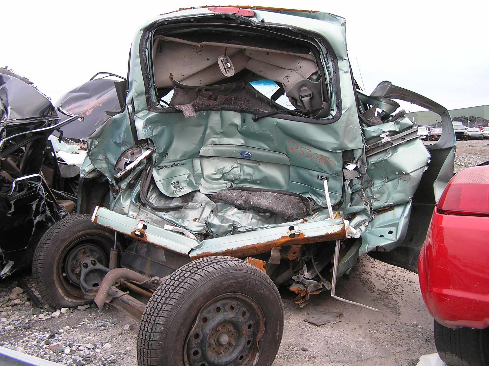 This minivan crash shows that rear liftgates could jam and obstruct access to patients trapped inside. The two manual lifter struts on this liftgate will have to be dealt with if the rescue team is to accomplish total liftgate removal. Photos by Ron Moore
