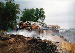 Remains of burned automobiles and boxcars carrying paper that also burned during the derailment. (Courtesy Miami Valley Fire District). Remains of burned automobiles and boxcars carrying paper that also burned during the derailment. (Courtesy Miami Valley Fire District).