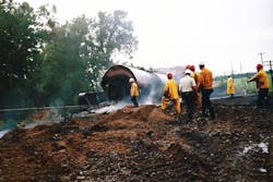 Remains of burned phosphorus tank car are inspected by officials once the fire had been extinguished.(Courtesy Miami Valley Fire District).