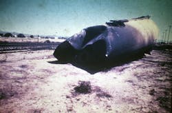 Portion of phosphorus tank car propelled by the force of the steam explosion inside the car. (Courtesy Sidney, NE, Fire Department). Portion of phosphorus tank car propelled by the force of the steam explosion inside the car. (Courtesy Sidney, NE, Fire Department).