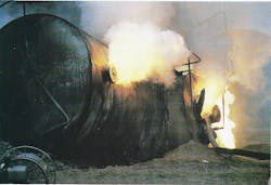 Several holes were created in the tank car during the derailment releasing water and causing the phosphorus to spontaneously combust. (Courtesy Andy Harp, Miami Valley Fire District, OH.) Several holes were created in the tank car during the derailment releasing water and causing the phosphorus to spontaneously combust. (Courtesy Andy Harp, Miami Valley Fire District, OH.)
