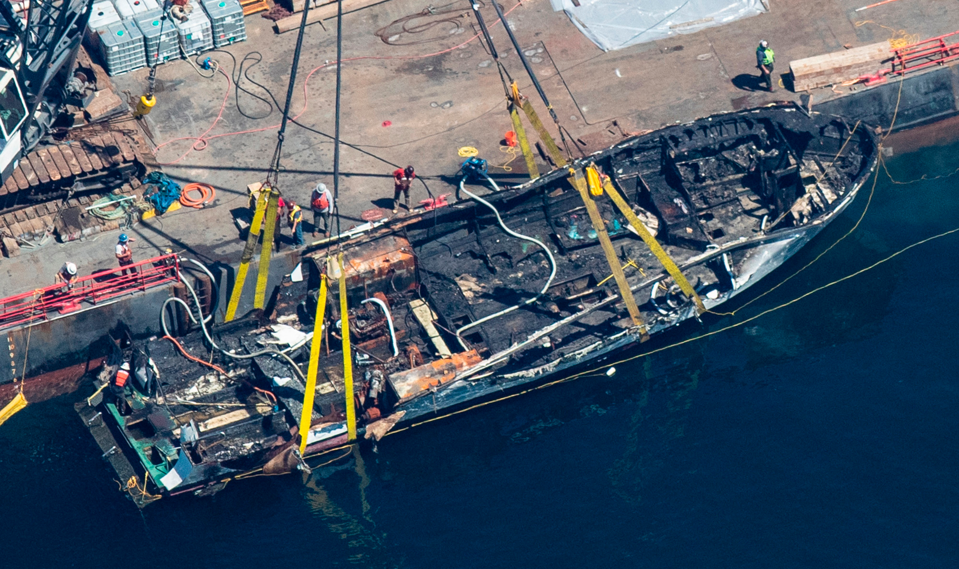 The burned hulk of the Conception is brought to the surface by a salvage team in the Santa Barbara Channel off of Santa Cruz Island, Calif., on Thursday, Sept. 12, 2019.