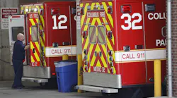 A Columbus Division of Fire paramedic gets ready to unload an ambulance at the emergency entrance at OhioHealth Grant Medical Hospital Downtown.