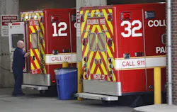 A Columbus Division of Fire paramedic gets ready to unload an ambulance at the emergency entrance at OhioHealth Grant Medical Hospital Downtown.