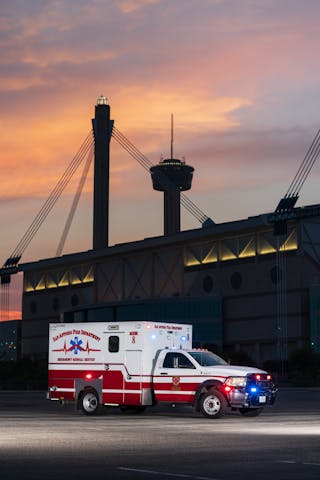 SAFD&apos;s newest medical unit in the fleet staged in front of the Alamodome and the Tower of the Americas.