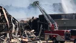 Firefighters continue Wednesday to douse the massive blaze at an Attalla, AL, paper products warehouse. Firefighters continue Wednesday to douse the massive blaze at an Attalla, AL, paper products warehouse.