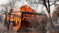 A house along State Highway 128 near Healdsburg, CA, is engulfed in flames by the Kincade fire on Sunday.