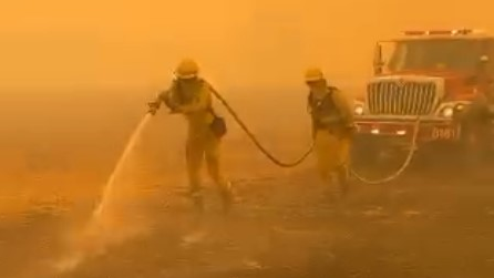 Firefighters battle the Kincade wildfire burning through Sonoma County, CA, on Sunday.