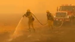 Firefighters battle the Kincade wildfire burning through Sonoma County, CA, on Sunday.