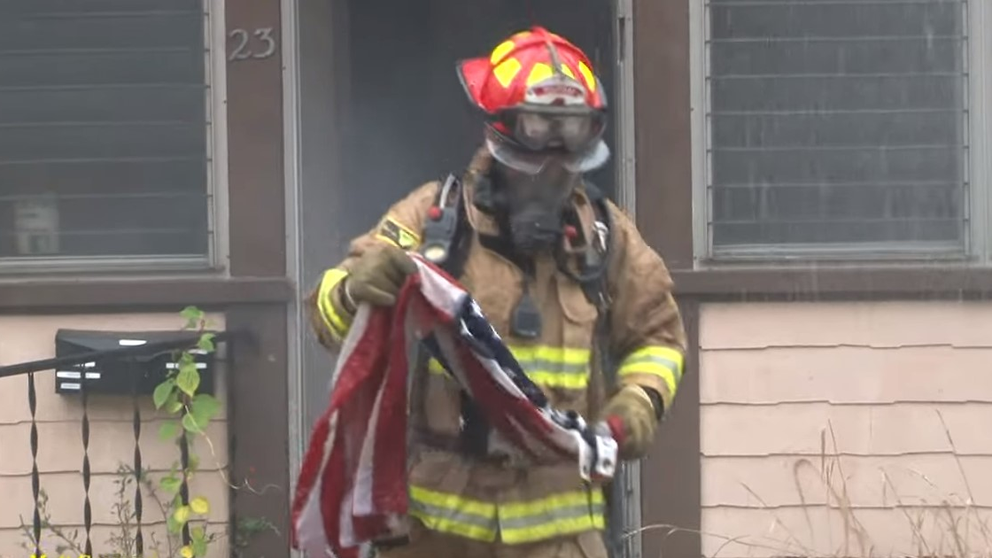 Milford, MA, Fire Lt. Billy Collins, a former Marine, rushed into a burning house Tuesday to save an American flag hanging inside from the flames.