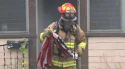 Milford, MA, Fire Lt. Billy Collins, a former Marine, rushed into a burning house Tuesday to save an American flag hanging inside from the flames.
