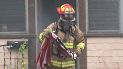 Milford, MA, Fire Lt. Billy Collins, a former Marine, rushed into a burning house Tuesday to save an American flag hanging inside from the flames. Milford, MA, Fire Lt. Billy Collins, a former Marine, rushed into a burning house Tuesday to save an American flag hanging inside from the flames.