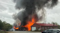 Firefighters from multiple departments battled a large blaze at an auto storage warehouse Sunday in Plainfield, CT.