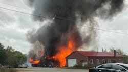 Firefighters from multiple departments battled a large blaze at an auto storage warehouse Sunday in Plainfield, CT.