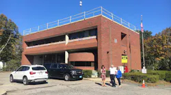 Plymouth, MA, Town Manager Melissa Affighi (left), Fire Chief Ed Bradley and Select Person Betty Cavacco examine Fire Station 1 on Tuesday.