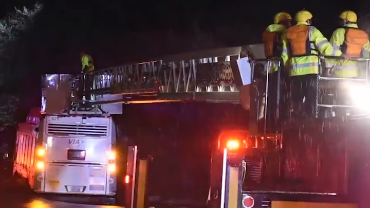 San Antonio firefighters rescued eight passengers from a bus stuck in high water Thursday.