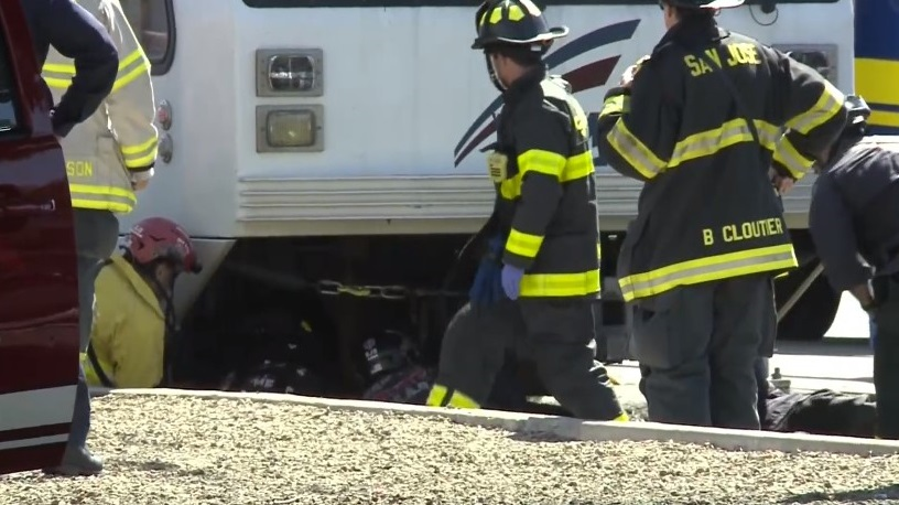 San Jose, CA, firefighters removed a man who struck and trapped under a light rail train early Tuesday.