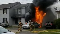 Syracuse, NY, firefighters extinguish flames from a burning 1969 Camaro parked in a garage over the weekend.