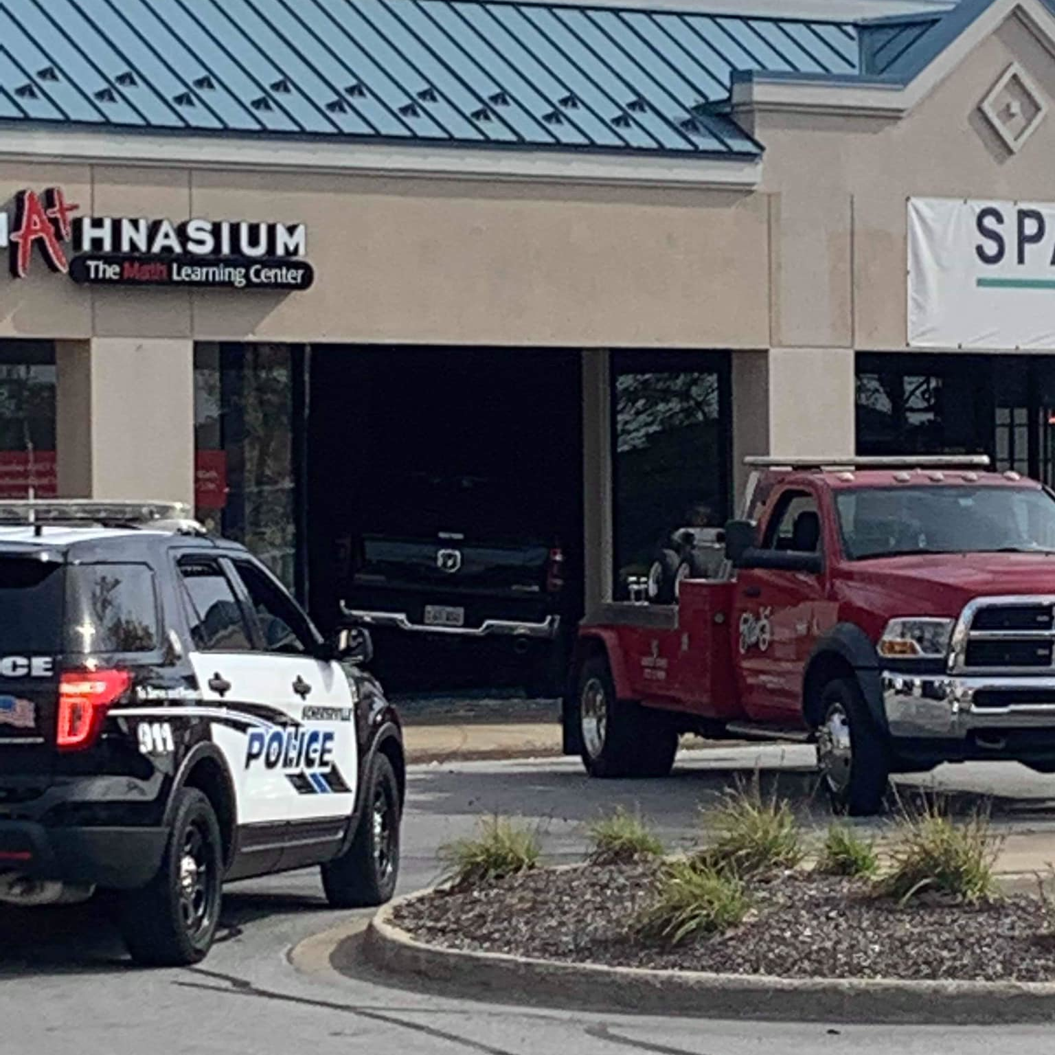 A woman suffered a medical emergency while behind the wheel of a pickup truck Friday, crashing through a vacant strip mall store in Schererville, IN.
