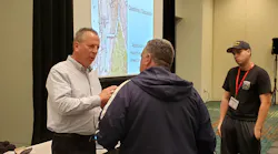 Philadephia Battalion Chief Vincent Mulray, left, speaks with firefighters who attended his class on an Amtrak train wreck at Firehouse Expo in Nashville.