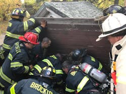 Brockton, MA, firefighters extricated two men Friday who were trapped when the roof of the shed they were in collapsed on them. Brockton, MA, firefighters extricated two men Friday who were trapped when the roof of the shed they were in collapsed on them.