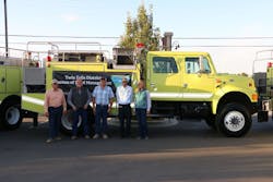 The Bureau of Land Management Twin Falls District Fire Management transferred wildland fire engines to five Rural Fire Readiness partners. Pictured are representatives from the Bliss Rural Fire District, Notch Butte Rangeland Fire Protection Association, Raft River Rural Fire Protection District, Saylor Creek Rangeland Fire Protection Association and the Shoshone Basin Rangeland Fire Protection Association.