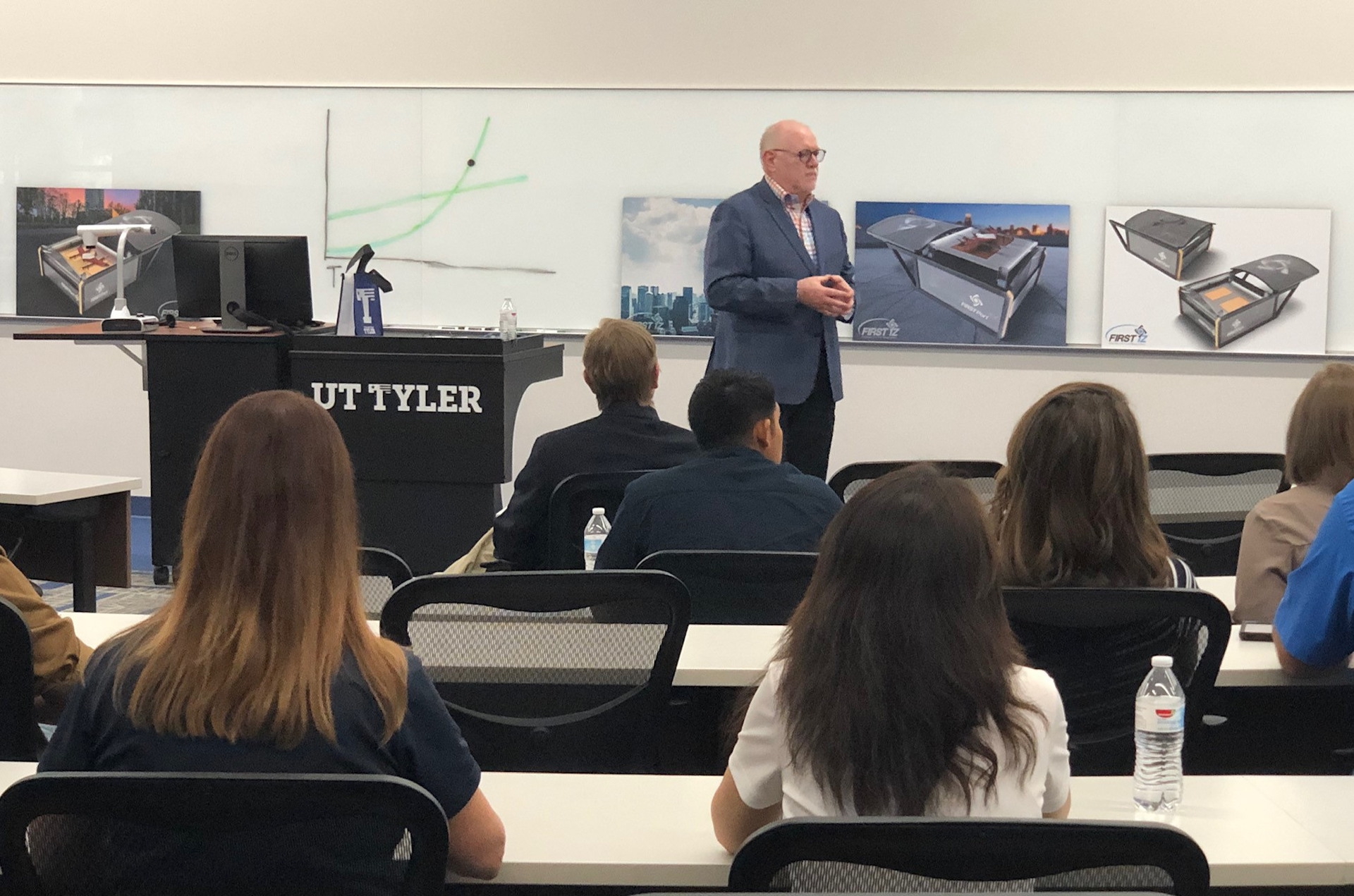 Phil Burks, FIRST iZ and attendees of the event.