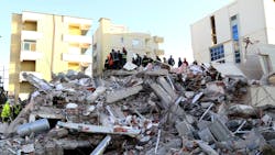 Emergency workers look for survivors trough the rubble of a damaged building in the coastal city of Durres, west of capital Tirana, after an earthquake hit Albania on Tuesday.