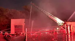 Two Baltimore City firefighters were injured while battling a two-alarm blaze Monday.