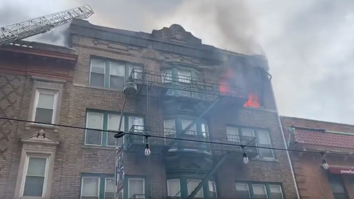 A firefighter and police officer were injured responding to a three-alarm apartment blaze Thursday in Bloomfield, NJ.