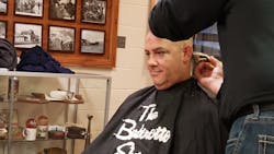 More than 100 firefighters shaved their heads as part of a fundraising event for Elkhart, IN, firefighter Travis Mahoney, who was recently diagnosed with lung cancer.