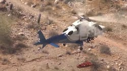Phoenix firefighters airlifted a woman who injured herself during a hike in June. But as they flew off, the woman's stretcher began to spin rapidly high above the ground. Now she's suing the city for $2 million. Phoenix firefighters airlifted a woman who injured herself during a hike in June. But as they flew off, the woman's stretcher began to spin rapidly high above the ground. Now she's suing the city for $2 million.