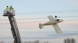 Shakopee, MN, firefighters rescue a pilot whose airplane became entangled in live electrical wires Saturday in Scott County. Shakopee, MN, firefighters rescue a pilot whose airplane became entangled in live electrical wires Saturday in Scott County.