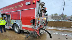 A Spanish Lake, MO, firefighter responding to a two-car crash Monday was injured after a pickup truck reportedly lost control on the icy road and hit the first responder's apparatus.