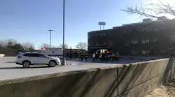Officials stand outside the Harvard Vanguard Medical Associates building in Braintree, MA, after a chemical spill hospitalized seven people on Wednesday, Nov. 6, 2019.