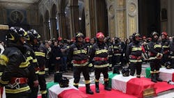 Italian firefighters pay their respects during a funeral mass on Friday, Nov. 8, 2019 for three of their colleagues who were killed in the line of duty in a farmhouse explosion. Italian firefighters pay their respects during a funeral mass on Friday, Nov. 8, 2019 for three of their colleagues who were killed in the line of duty in a farmhouse explosion.