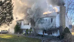 North Branford firefighters battle a house fire where a woman was removed after being trapped in the basement. North Branford firefighters battle a house fire where a woman was removed after being trapped in the basement.