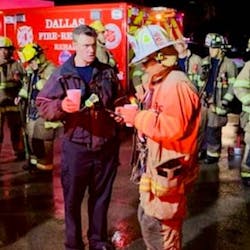 Dallas Assistant Chief Justin Ball (left) and Operations Chief Charlie Salazar at the scene of damage following a tornado that touched down in the Dallas-Fort Worth area Oct. 20, 2019.