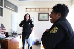 Portland Fire Chief Sara Boone, right, shares a laugh with Fire Marshal AJ Jackson at the fire bureau administration headquarters in October 2019.