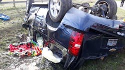 Although the third-row roof-mounted airbag on a Chevrolet Tahoe deployed during this rollover crash, the second-row roof-mounted airbag didn’t. A fire/rescue member sprawled on his belly to partially crawl into the open window of the passenger side rear door to access trapped children in the second-row seat. In this position, the fire/rescue member was lying on the undeployed airbag. It inflated into the responder’s abdomen and pelvic area. Although the third-row roof-mounted airbag on a Chevrolet Tahoe deployed during this rollover crash, the second-row roof-mounted airbag didn’t. A fire/rescue member sprawled on his belly to partially crawl into the open window of the passenger side rear door to access trapped children in the second-row seat. In this position, the fire/rescue member was lying on the undeployed airbag. It inflated into the responder’s abdomen and pelvic area.