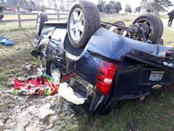 Although the third-row roof-mounted airbag on a Chevrolet Tahoe deployed during this rollover crash, the second-row roof-mounted airbag didn’t. A fire/rescue member sprawled on his belly to partially crawl into the open window of the passenger side rear door to access trapped children in the second-row seat. In this position, the fire/rescue member was lying on the undeployed airbag. It inflated into the responder’s abdomen and pelvic area. Although the third-row roof-mounted airbag on a Chevrolet Tahoe deployed during this rollover crash, the second-row roof-mounted airbag didn’t. A fire/rescue member sprawled on his belly to partially crawl into the open window of the passenger side rear door to access trapped children in the second-row seat. In this position, the fire/rescue member was lying on the undeployed airbag. It inflated into the responder’s abdomen and pelvic area.