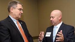 New Columbia, MO, Fire Chief Andy Woody (right) speaks to Tim Teddy, Columbia director of community development, during a public meet-and-greet event for the three chief finalists. New Columbia, MO, Fire Chief Andy Woody (right) speaks to Tim Teddy, Columbia director of community development, during a public meet-and-greet event for the three chief finalists.