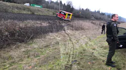 Police use spike strips to stop the Cowlitz 2 Fire & Rescue ambulance following a pursuit.