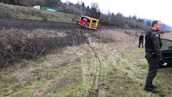 Police use spike strips to stop the Cowlitz 2 Fire &amp; Rescue ambulance following a pursuit.