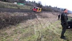 Police use spike strips to stop the Cowlitz 2 Fire & Rescue ambulance following a pursuit. Police use spike strips to stop the Cowlitz 2 Fire & Rescue ambulance following a pursuit.